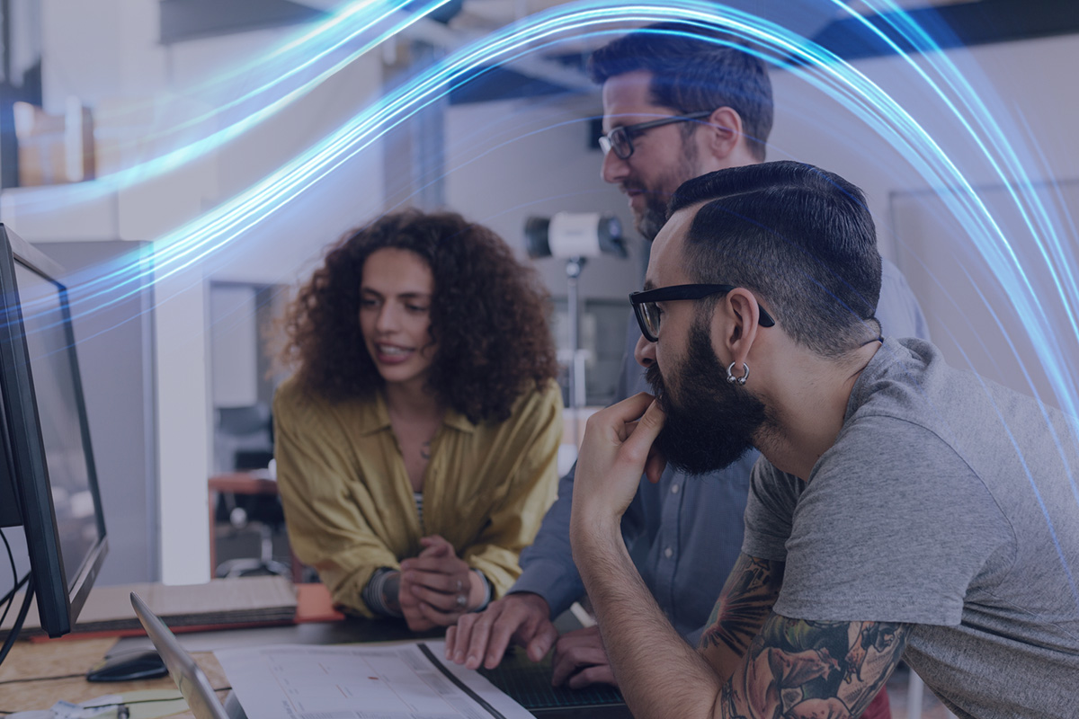 Man and woman looking at laptop in warehouse