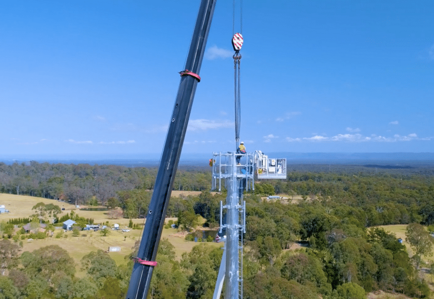 Photo of an nbn technician doing work at a fixed wireless tower.