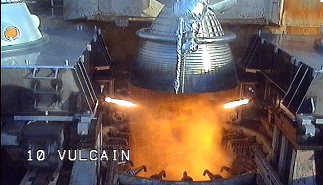 An extreme close up of a rocket's engine as the launch starts and flames begin to form