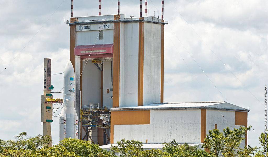 A rocket sits on a launchpad waiting to be launched into space