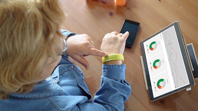 Senior woman using health technology