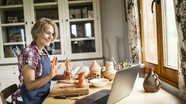 Middle age female vlogger making a vlog:  how to create sculpture